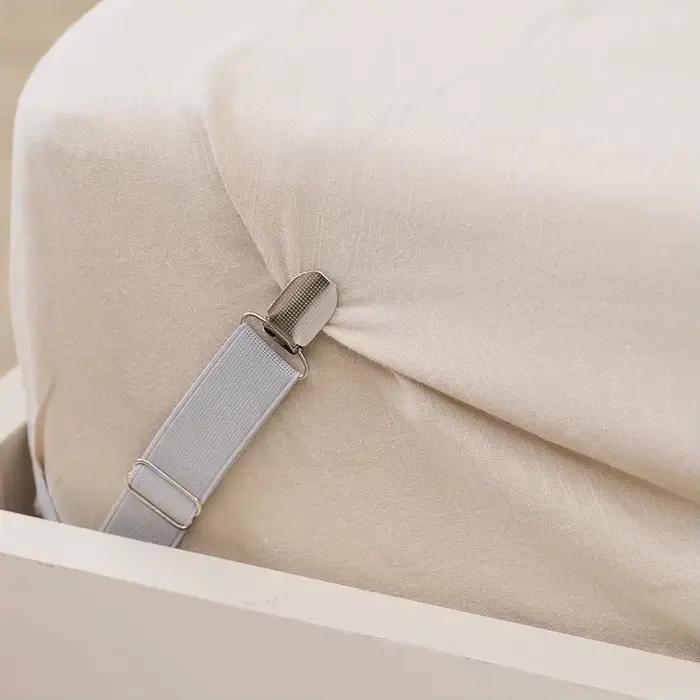 Attache antidérapante réglable pour drap de lit