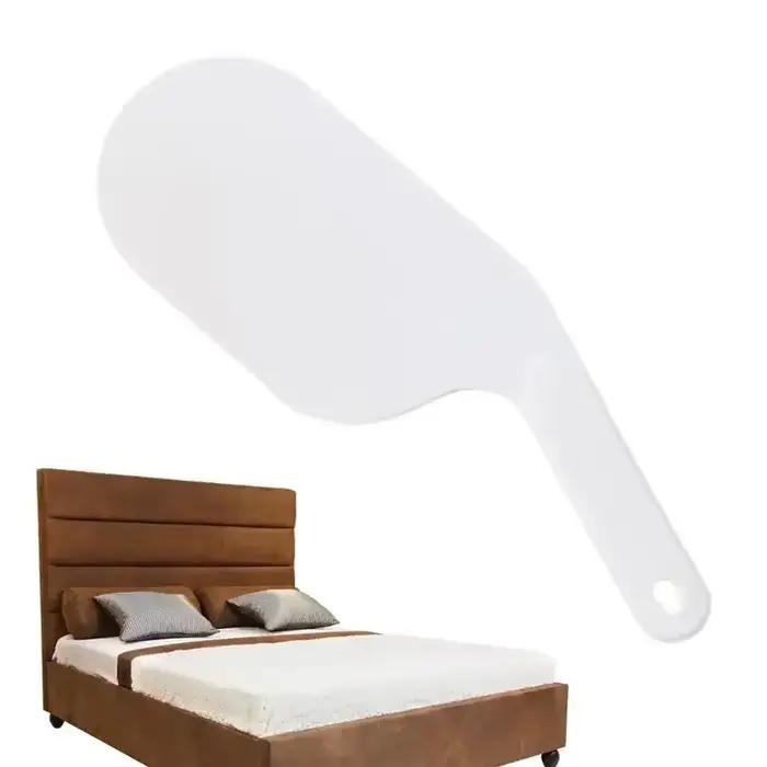 Outil d'aide au changement de drap de lit