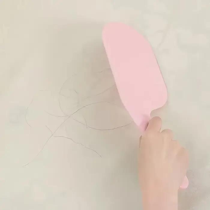 Outil d'aide au changement de drap de lit