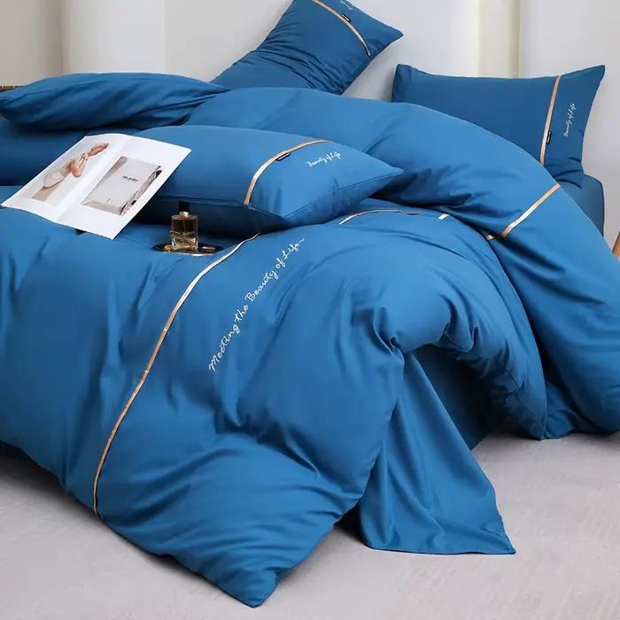 Nouvel ensemble de draps et de draps-housses 4 pièces en coton lavé doux pour la peau, couleur unie, avec ruban brodé et double bordure