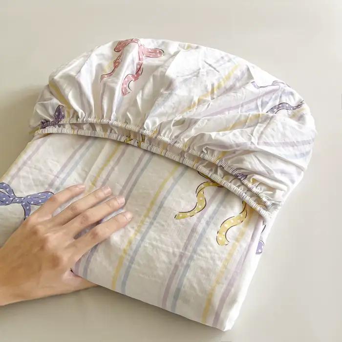 Ensemble de draps de lit à nœud rayé